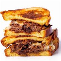 *Modern Grilled Cheese* · Slow-roasted short rib topped with melted mozzarella cheese and finished with fig jam. Add m...