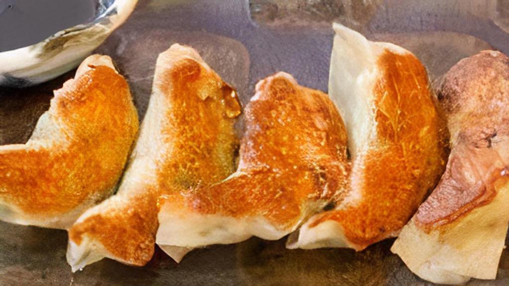 Homemade Pork Gyoza(5) · Pan-fried pork dumplings.