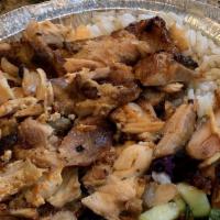 Chicken Gyro Plate · Layers of marinated chicken thighs wrapped around large vertical split and grilled in front ...