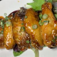 Furious Thai Wings · Spicy. Fried until golden and blended with chef's spicy sauce. Glazed with sriracha sauce.