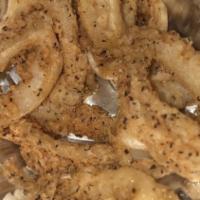 Golden Calamari · Calamari battered then fried to a golden crisp. Served with sweet chili sauce and ground pea...