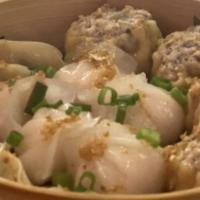Vegetable Dumpling · Vegetarian. Steamed vegetable dumpling with chives and leek. Served with dipping soy sauce.