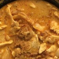 Massaman Curry · Onions, potatoes, peanuts and coconut milk. Served with jasmine rice.
