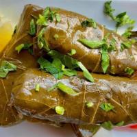 Grape Leaves · Rich parsley onions and our unique herbs wrapped in  thin and tasty imported grape leaves an...