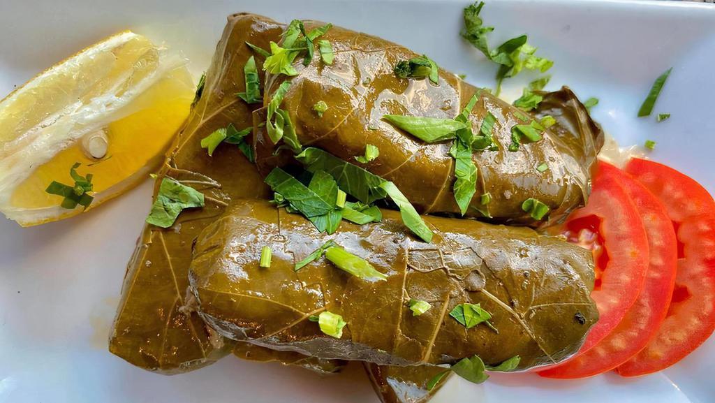 Grape Leaves · Rich parsley onions and our unique herbs wrapped in  thin and tasty imported grape leaves and drizzled with our special dressing and fresh lemon. A Mediterranean Classic and great aperitif.