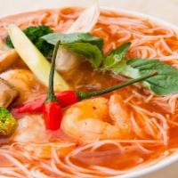 Tom Yum Noodle Soup · Rice noodles with scallions, beans spout, fried garlic, ground peanut, cilantro and Tom Yum ...