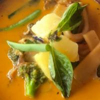 Pineapple Curry · Pineapple, strings bean, bamboo shoot, basil, eggplant, bell pepper and coconut sauce