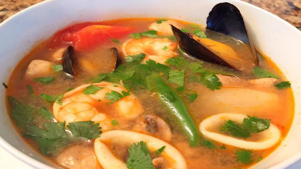 Seafood Soup · Hot & sour soup with mussels, shrimp, squid, bell pepper, basil leaves