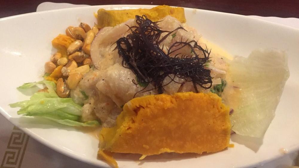Ceviche Mixto · Diced fish filet and seafood in lemon juice and hot pepper, served with corn and sweet potatoes.