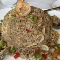 Arroz Con Mariscos · Yellow rice and seafood combination.