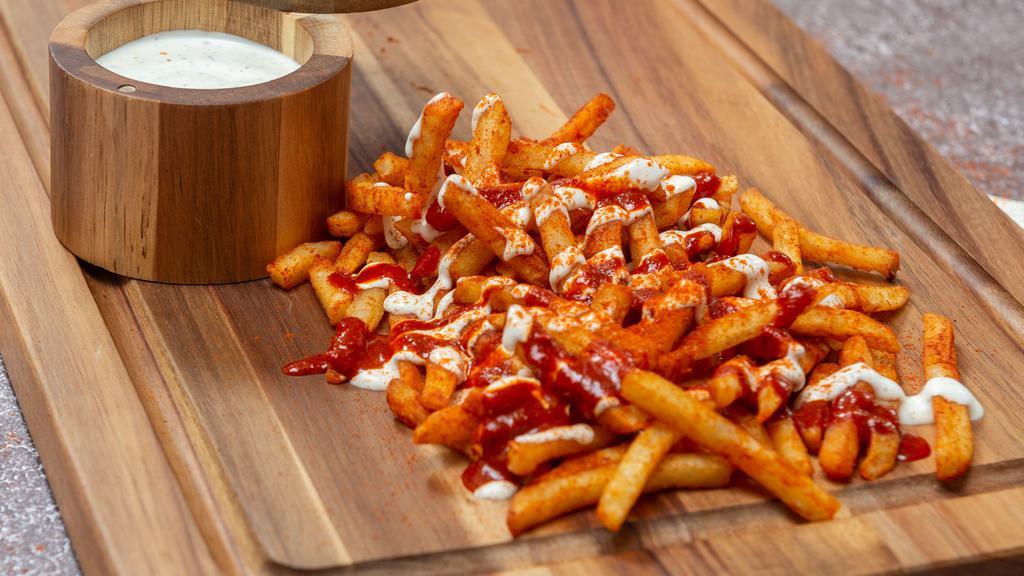 Mean Fries · Fries topped with white and red sauce.

PS: The sauces make them mean!