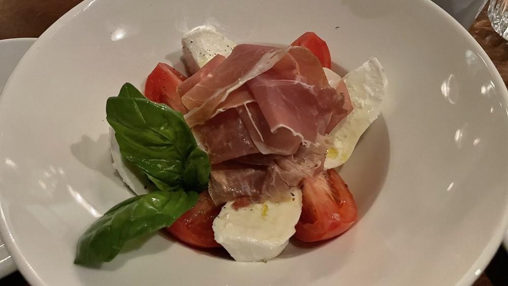 Caprese · buffalo mozzarella, basil, beefsteak tomatoes, extra virgin olive oil. Add prosciutto for an additional charge.