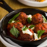 Polpette · Beef, pork, or veal meatballs, marinara, Calabrian chiles, ricotta, and Parmesan.
