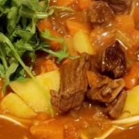 Beef Curry Udon · Beef curry with onions, carrots, potatoes with udon (wheat flour noodles).