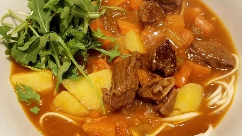 Beef Curry Udon · Beef curry with onions, carrots, potatoes with udon (wheat flour noodles).