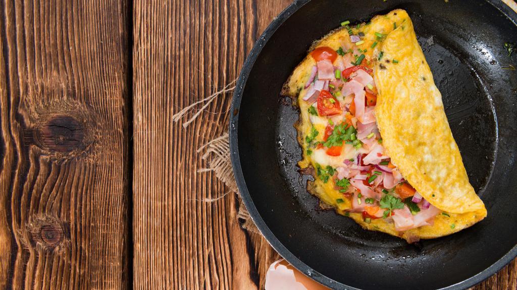 Ham & Bacon Omelette With Home Fries · Fresh eggs, crispy bacon, and ham omelette, served with home fries.