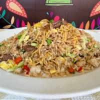Aeropuerto De Carne · Peruvian fried rice mixed with Chinese noodles with veggies and a choice of your favorite me...