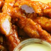 10 Pieces Boneless Buffalo Wings (1 Dip) · Fresh jumbo white meat chicken tenders covered with your choice of our wing sauce. Served wi...