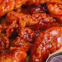 15 Pieces Boneless Buffalo Wings (1 Dip) · Fresh jumbo white meat chicken tenders covered with your choice of our wing sauce. Served wi...