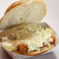 Roman Chicken Sandwich · Crispy chicken with melted mozzarella cheese and garlic sauce.