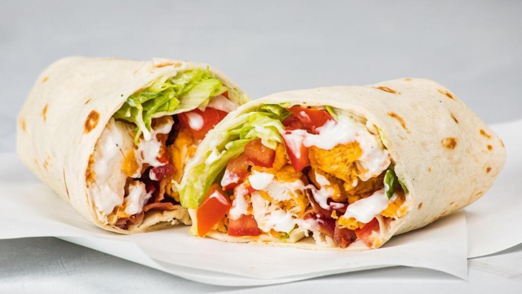 Chicken Bacon Ranch Wrap · Grilled or Fried Chicken, Served with Applewood Smoked Bacon, Buttermilk Ranch, Lettuce, Tomato, and your Favorite Flavor! 818-1,560 cal.