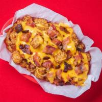 Loaded Garlic Parm Tots · Our signature Garlic Parm Tots covered in melted cheese and crispy bacon! 477 cal.