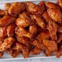 50 Wings · 50 Crispy Jumbo Wings with up to 3 of your Favorite Flavors! 10,000-12,566 cal.