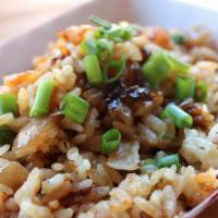 Veggie Fried Rice · Our signature nurungji fried rice with onions and peas.