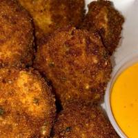 Fried Pickles · Delicious house made crispy fried pickles, served with a side of boom-boom.