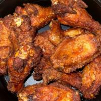 Bone-In Wings · One dozen deep fried crispy wings, tossed in your choice of sauce and side of ranch or blue ...