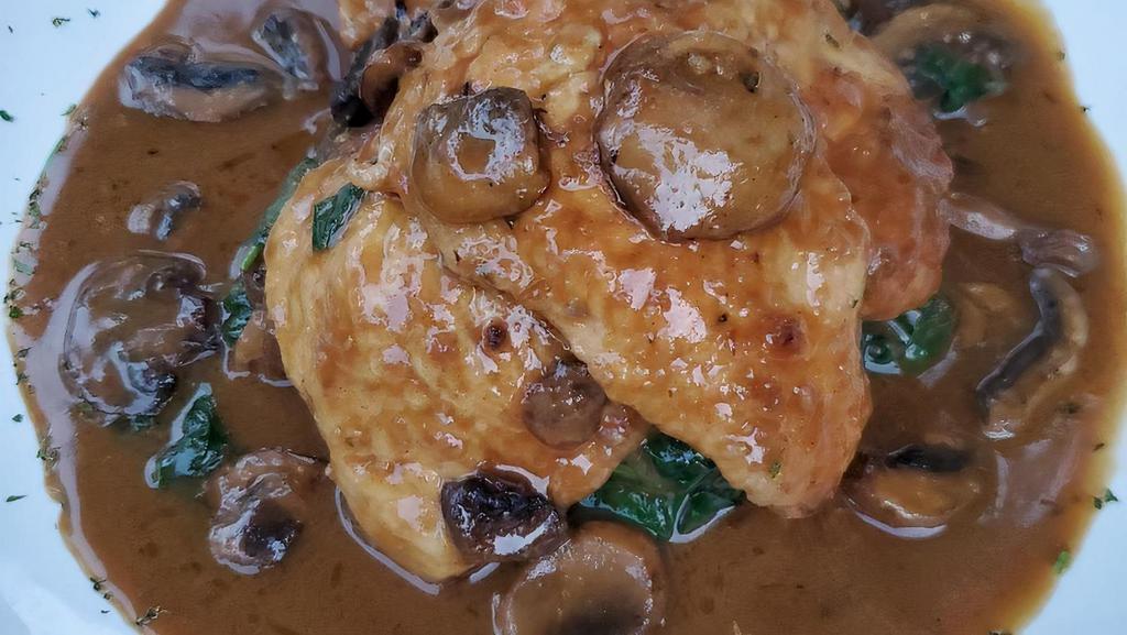 Chicken Marsala · Mushrooms Marsala sauce, creamy polenta and Tuscan kale.