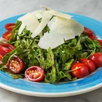 Pomodorini Salad · Arugula, cherry tomatoes, shaved Parmesan and balsamic vinaigrette.