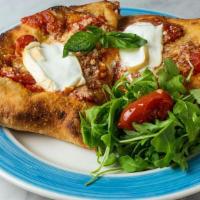 Calzone Song'E Napule · Deep fried calzone filled with smoked mozzarella, prosciutto cotto (ham),, ricotta, topped w...