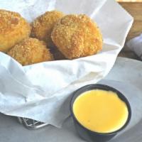 Mac & Cheese Bites · Breaded and fried mac & cheese bells, served with a choice of dipping sauce: cheese sauce ch...