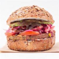 Bombay Burger · Vegan patty with avocado, slaw, pickled onions, tomato, date chutney and vegan mayo on a mul...