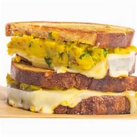 Aloo Grilled Cheese · Samosa meets sandwich, melted muenster and sharp white cheddar, organic sourdough. (V)