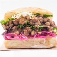 Chana Masala Sandwich · Slow-cooked chickpeas topped with mixed greens, pickled onions, and house-made date chutney ...