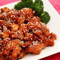 Sesame Chicken (White Meat) · On chunk of chicken sprinkled with sesame seeds and brod.
