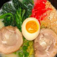 Tonkotsu Ramen · Rich and creamy pork base in soup with char siu, choy sum, chopped garlic, green onion, soft...