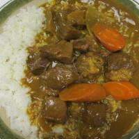 Beef Curry Rice · Tendered beef dices, golden curry sauce, carrot on white rice.