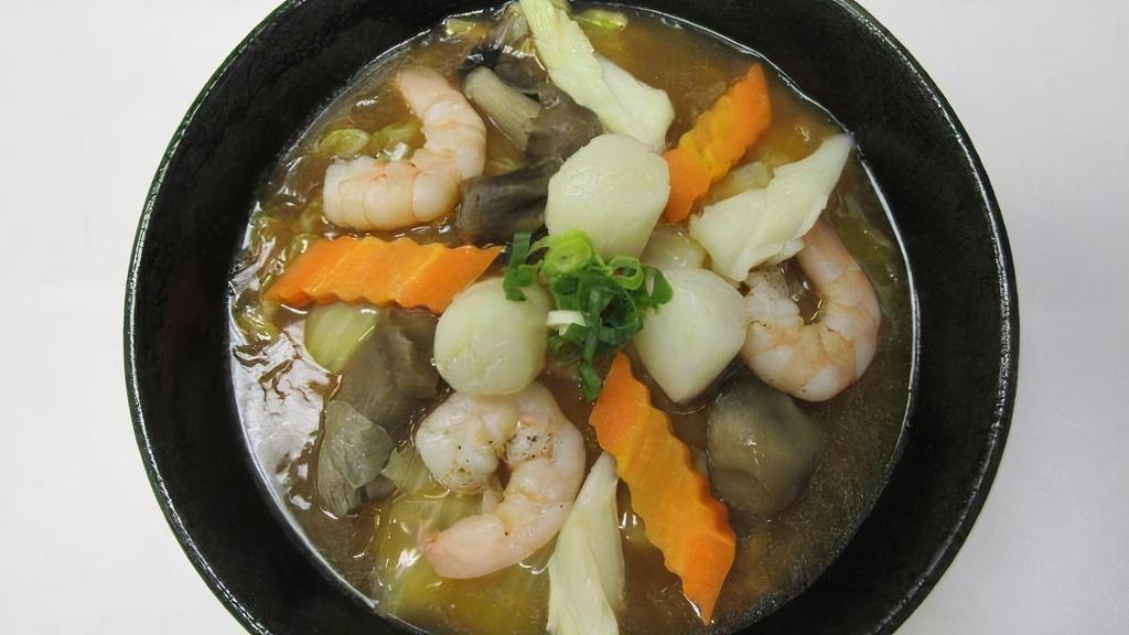 Seafood Ramen · Shoyu base in soup with shrimp, scallop, squid, mushroom, carrot, ground onion, cabbage, green onion, broccoli.