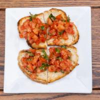 Bruschetta · Grilled bread rubbed with fresh garlic topped with tomatoes marinated in extra virgin olive ...