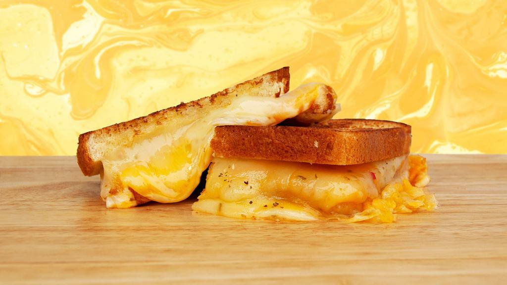 Grown Up Grilled Cheese · Melted cheddar, mozzarella, and jack cheese between two slices of buttery grilled bread.