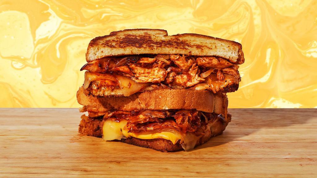 Bbq Chicken Grilled Cheese · Melted cheddar and jack cheese, chicken, caramelized onions, and BBQ sauce between two slices of buttery grilled bread.