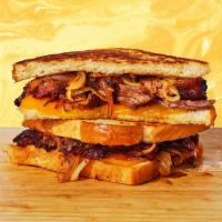 Bbq Brisket Grilled Cheese · Melted cheddar and jack cheese, smoked beef brisket, and BBQ sauce between two slices of but...