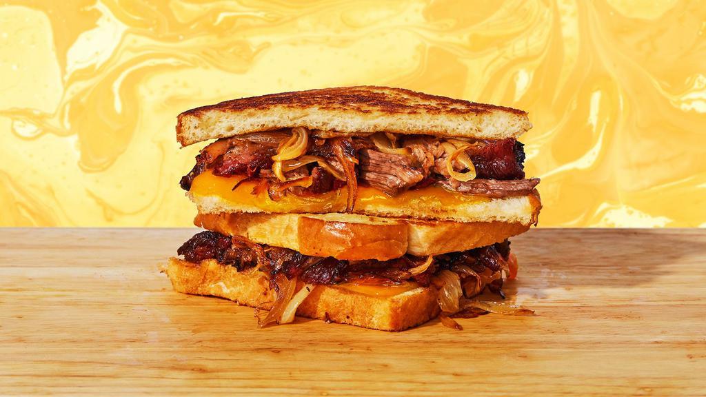 Bbq Brisket Grilled Cheese · Melted cheddar and jack cheese, smoked beef brisket, and BBQ sauce between two slices of buttery grilled bread.