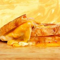 Jalapeno Cheddar Grilled Cheese · Melted cheddar and pepper jack cheese, spicy jalapenos, and mayo between two slices of butte...