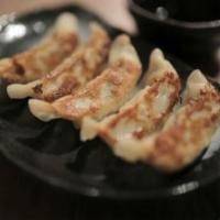 Homemade Gyoza · Served with soy sauce
