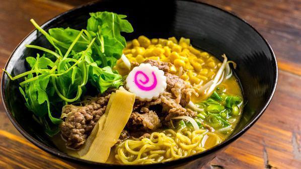 Meijin Miso Beef Ramen · Signature miso flavored broth with corn and sliced beef. Served with rich and creamy beef broth topped with bean sprouts, arugula, Naruto, and green onions.