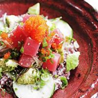 Hawaiian Tuna Poke Bowl · Seaweed, cucumber, avocado, sesame, chili oil, scallions, purple rice, tobiko, and Japanese ...